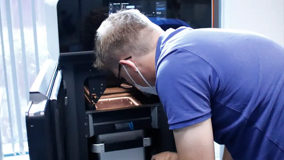 an engineer using our 3D printer to print a prototype